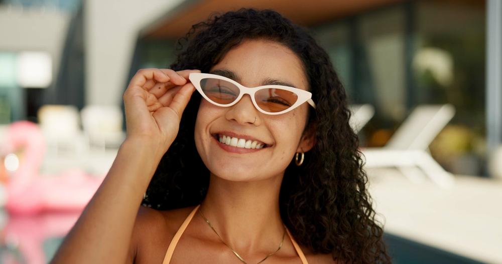 A young woman enjoying her spring break. Following spring break road safety tips can help you reach your destination without any issues.