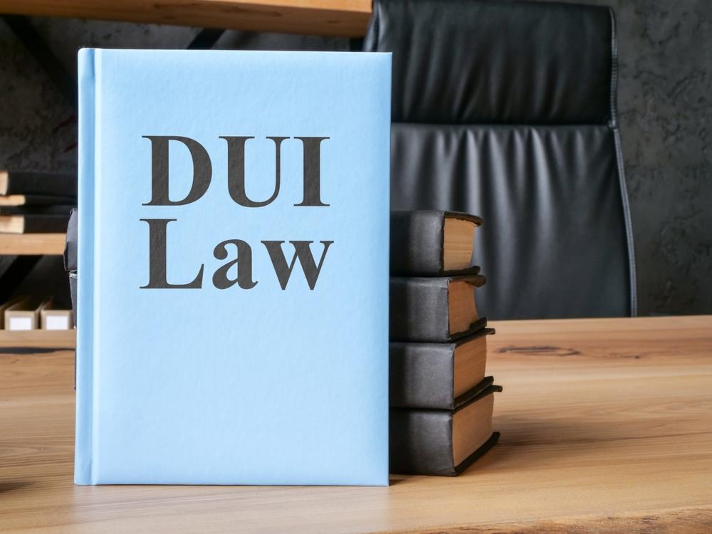 A DUI law book rests on a desk in a court. Teague Law is here to explain 2026 Georgia DUI laws and penalties.